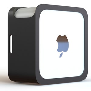 May include: A black and white square-shaped electronic device with rounded corners. The device has a cut-out apple logo on the white front panel. A handle is integrated into the top, and a vertical slot is on the side.