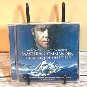 May include: A CD case for the movie "Master and Commander: The Far Side of the World" is displayed. The cover features a portrait of a man and a ship sailing on the ocean. The text "Music from the Motion Picture" is visible.