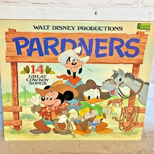 May include: A vintage vinyl record album cover featuring Mickey Mouse, Donald Duck, and Goofy dressed as cowboys. The album is titled "Partners" and features 14 great cowboy songs. The cover is illustrated in a cartoon style with a rustic western background.