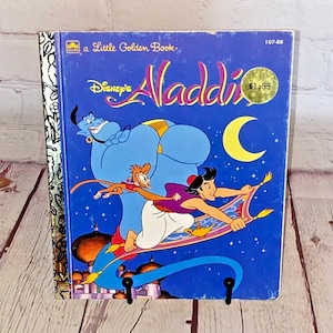 Disney&#39;s Aladdin Hardcover Book by Golden Books 1993 | Adapted by Karen Krieder and Illustrated by Darrell Baker | See Photos & Read!
