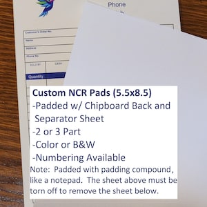May include: White custom NCR pads, 5.5 x 8.5 inches, with a blue logo and text. Features include a chipboard back, separator sheet, and options for 2 or 3 parts, color or B&W, and numbering. The pads are padded like a notepad.