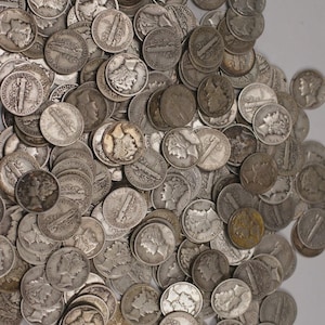 May include: A large pile of silver Mercury dimes, showing the profile of a woman on the obverse and a bundle of rods on the reverse. The coins are scattered, with varying degrees of wear and patina, creating a textured, metallic surface.