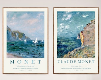 May include: Two framed art prints of Claude Monet's paintings. The first print is titled "Cliffs and Sailboats at Belle-Isle" and the second print is titled "Cliff at Étretat". Both prints feature a blue and white color scheme and depict seascapes.