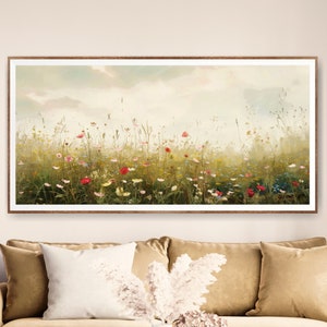 May include: A framed painting of a field of wildflowers in shades of pink, white, and red. The flowers are in a field of green grass with a light blue sky in the background.