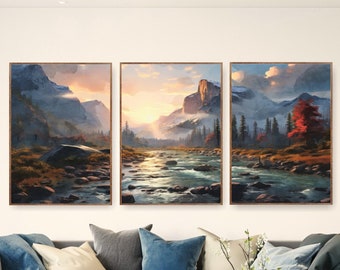 May include: Three framed landscape paintings depicting a mountain river scene with a sunset in the background. The paintings are hung on a white wall above a gray couch with pillows and a throw blanket.