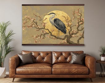 May include: A framed wall art print featuring a heron perched on a flowering branch against a golden sun. The artwork has a Japanese aesthetic, with a brown frame and a neutral background. The heron is gray and black.
