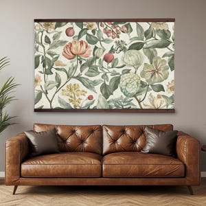 Vintage floral tapestry featuring detailed illustrations of various flowers and green leaves, printed on light canvas-textured fabric, with walnut-colored wooden hangers on top and bottom.