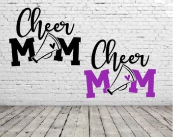 May include: Two versions of a "Cheer Mom" design with a megaphone and heart. The top design is black and the bottom design is purple.