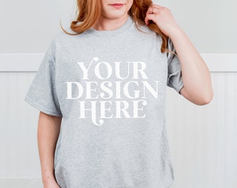 May include: A gray t-shirt with the text "YOUR DESIGN HERE" printed in white on the front.