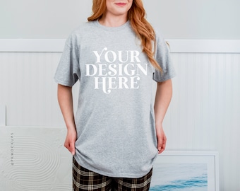 May include: A gray t-shirt with the text "YOUR DESIGN HERE" printed in white on the front.