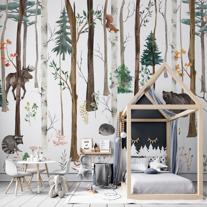 May include: A wall mural featuring a watercolor forest scene with a moose, raccoon, squirrel, hedgehog, and bear. The design includes tall brown and white trees, green pine trees, and small plants. A house-shaped bed frame sits in the foreground.
