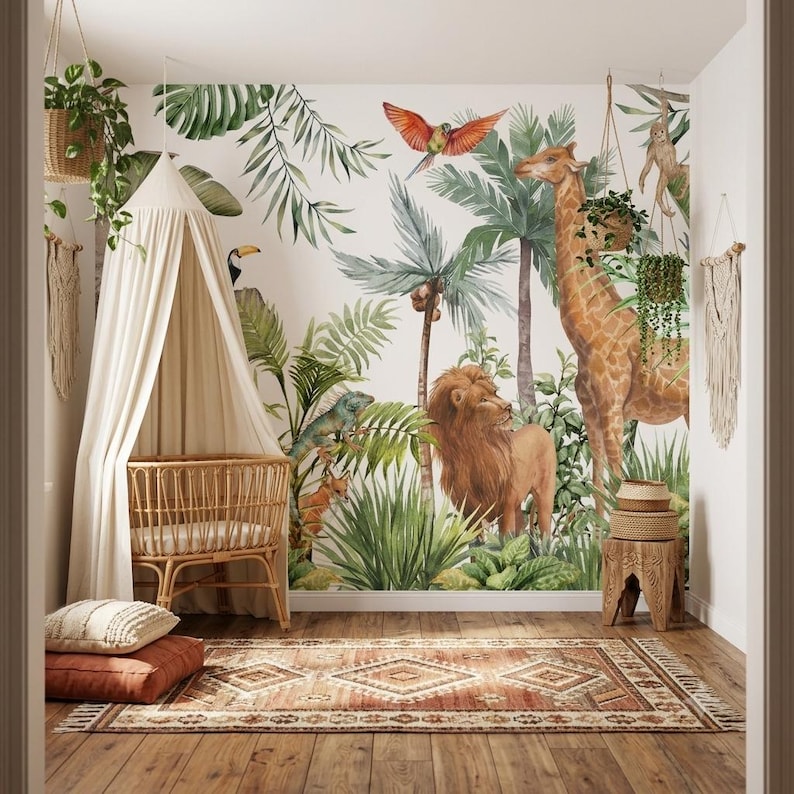 May include: A nursery room featuring a jungle-themed wall mural with a giraffe, lion, and tropical birds. A rattan crib sits under a cream-colored canopy. A patterned rug in shades of brown and cream lies on the wooden floor, with hanging plants.