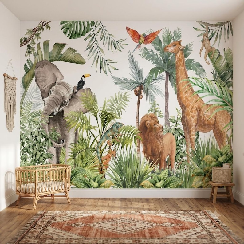 May include: A wall mural featuring a watercolor jungle scene with a gray elephant, a tall giraffe, a lion, a toucan, a parrot, and a monkey amidst green palm leaves and tropical plants. A rattan crib and a patterned rug are in the foreground.