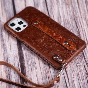 Funda de piel sintética con correa de muñeca para iPhone 16e, 15 Pro Max, 15 Plus, 14 Pro Max, 13 Pro Max, 13mini, funda de piel con tapa completa y flexible, parte trasera en marrón claro