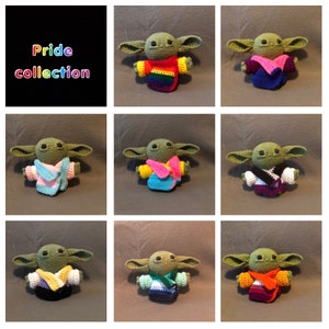 May include: A collection of crocheted figures, each resembling a character with large ears and dark eyes. The figures are dressed in various outfits representing Pride flags, including rainbow, pink, blue, and white. The text "Pride collection" is displayed in rainbow colors.