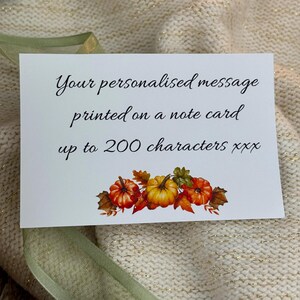 May include: A white note card with the text "Your personalised message printed on a note card up to 200 characters xxx." The card features a watercolor illustration of pumpkins and fall leaves.