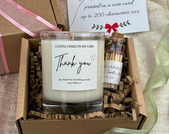 May include: A gift box containing a candle, matches, and a note card. The candle has a label that reads "Thank you." The matches are in a small glass bottle. The note card has text that reads "Your personalized message printed on a note card up to 200 characters."