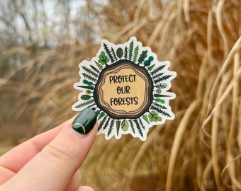 May include: A round sticker with a tree trunk design and the text "Protect Our Forests". The sticker is surrounded by green leaves and branches.