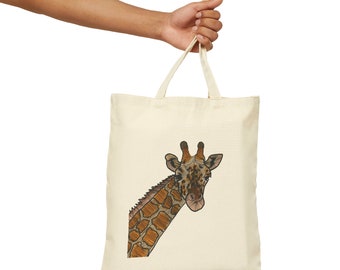 May include: A beige tote bag with a brown and black giraffe illustration on the front. The giraffe's head is peeking out from the top of the bag.