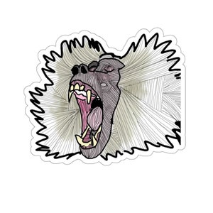 May include: A black and white line drawing of a baboon with its mouth open, showing its teeth. The baboon has a large mane of hair.