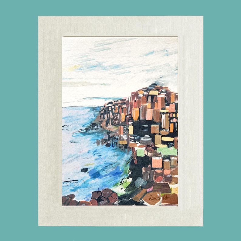 May include: A watercolor painting of a rocky coastline with a blue sky and ocean. The rocks are painted in shades of brown, orange, and green. The painting is signed "Laurie 1990" in the bottom right corner.