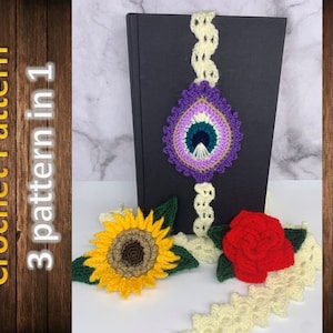 Könnte beinhalten: Drei Häkelmuster in einem: ein violettes und grünes augenförmiges Lesezeichen, eine gelbe Sonnenblume und eine rote Rose. Die Muster sind auf einem schwarzen Hintergrund mit weißer Häkelspitze dargestellt.