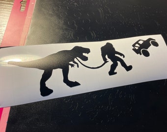 Jeep XJ or Toyota FJ with Sasquatch leading dinosaur vinyl decal