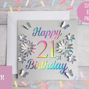 May include: A gray card with a holographic finish features the text "Happy 21st Birthday" with a large number 21. The card is decorated with flowers and butterflies.