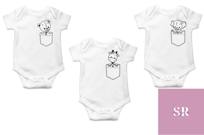 May include: Three white baby onesies with a pocket on the front. Each onesie features a different animal peeking out of the pocket: a bear, a giraffe, and an elephant. The animals are black and white.