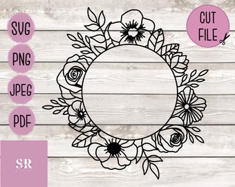 May include: Black and white floral wreath with a circular frame in the center. The wreath is made up of roses, leaves, and other floral elements.