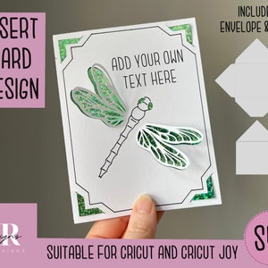 May include: A white card with a green dragonfly design and the text "Add your own text here". The card is suitable for Cricut and Cricut Joy machines. It includes an envelope and liner.