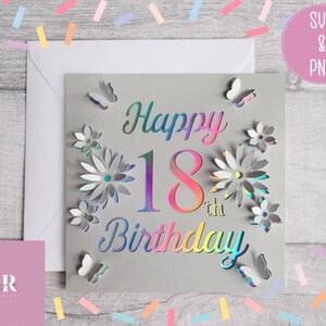 May include: A gray card with a holographic design that says "Happy 18th Birthday" with flowers and butterflies around the text.