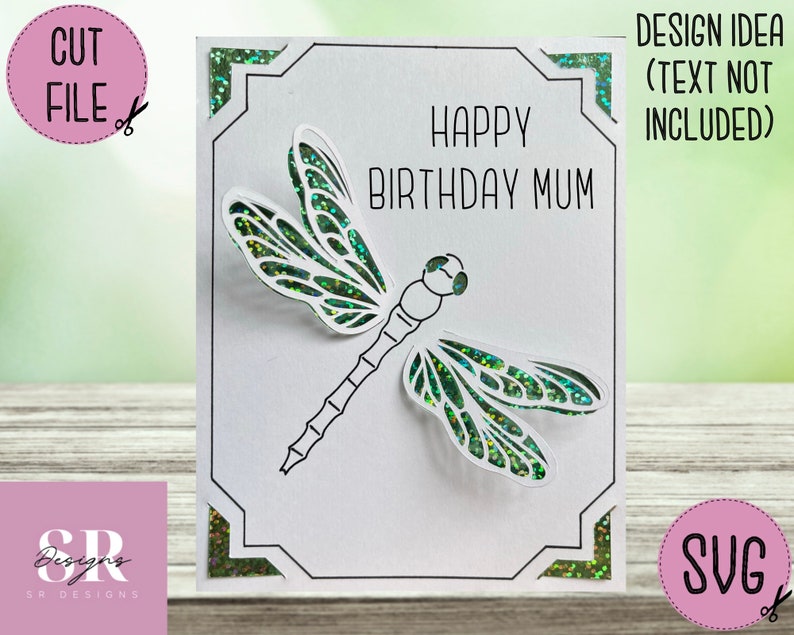 May include: A white card with a black border and a green dragonfly cut out. The card says "Happy Birthday Mum".