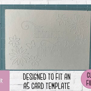 May include: A white card with the text "Thinking of You" in a decorative font. The card is decorated with a floral design and butterflies. The card is designed to fit an A5 card template.