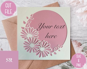 May include: A white card with a pink circle in the center. The circle has the text "Your text here" in black cursive writing. The circle is surrounded by a white floral design with two large flowers and leaves.