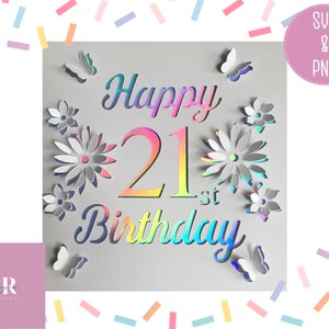 May include: A white card with a holographic iridescent finish featuring the text "Happy 21st Birthday" surrounded by flowers and butterflies.