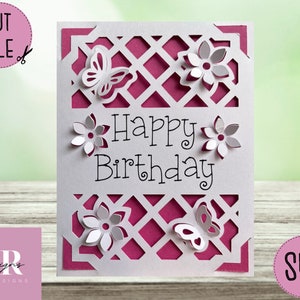 May include: A white birthday card with a lattice design, butterflies, and flowers. The words "Happy Birthday" are in the centre. The card has a magenta backing and the words "CUT FILE" and "SVG" are in the corners.