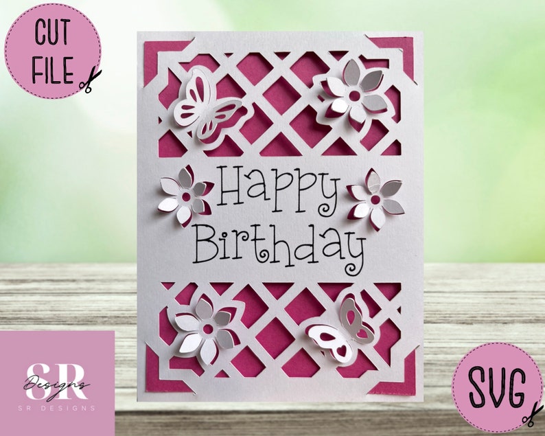 May include: A white birthday card with a lattice design, butterflies, and flowers. The words "Happy Birthday" are in the centre. The card has a magenta backing and the words "CUT FILE" and "SVG" are in the corners.