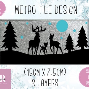 May include: A rectangular Metro Tile Design with a silver glitter background. The design features black silhouettes of deer, trees, and stars. The tile measures 15cm x 7.5cm and is 3 layers. The text "Metro Tile Design" is at the top.