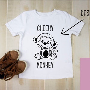 May include: White t-shirt with a black and white illustration of a monkey and the text "Cheeky Monkey".