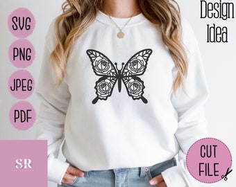 Könnte beinhalten: Ein weißes Sweatshirt mit einem schwarzen Schmetterlingsdesign aus Rosen. Der Schmetterling befindet sich mittig auf der Vorderseite des Sweatshirts.