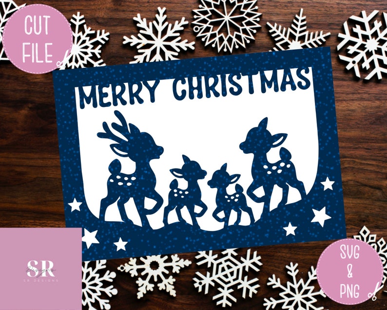May include: A blue card with a white background and the text "Merry Christmas" in a white font. The card features a silhouette of three deer with white spots, standing on a blue background with white stars.