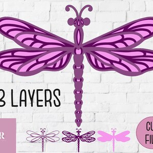 May include: A three-layer purple dragonfly cut file for crafting. The dragonfly has intricate details and is perfect for paper crafts, card making, and scrapbooking.