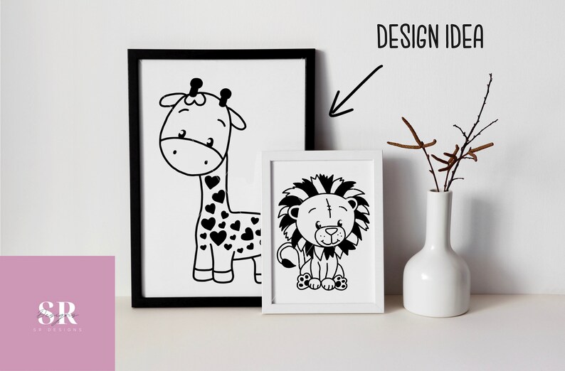 May include: Two black and white illustrations of animals in white frames. The left frame shows a giraffe with a heart pattern. The right frame shows a lion with a mane. The frames are on a white surface with a white vase and brown branches.