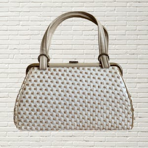 Cartera vintage de los años 60 en tejido de color crema con asa superior de piel - MCM