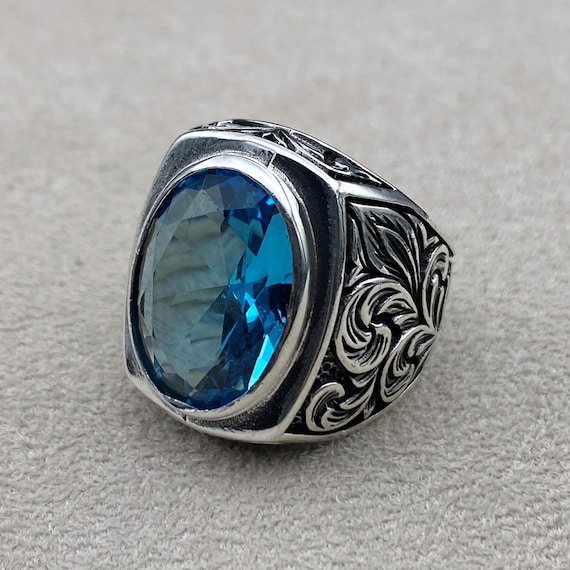 Gentlemans Choice Sterling Silver-Plated Ring Featuring A London Blue Topaz  Center Stone Accented With 3 Diamonds On Each Side
