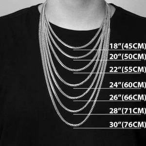 May include: A selection of silver chain necklaces of varying lengths, displayed on a person wearing a black shirt. The lengths are labeled: 18" (45CM), 20" (50CM), 22" (55CM), 24" (60CM), 26" (66CM), 28" (71CM), and 30" (76CM).