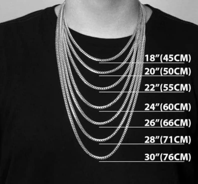 May include: A selection of silver chain necklaces of varying lengths, displayed on a person wearing a black shirt. The lengths are labeled: 18" (45CM), 20" (50CM), 22" (55CM), 24" (60CM), 26" (66CM), 28" (71CM), and 30" (76CM).