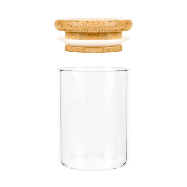 May include: A clear glass jar with a bamboo lid. The lid has a white silicone seal.