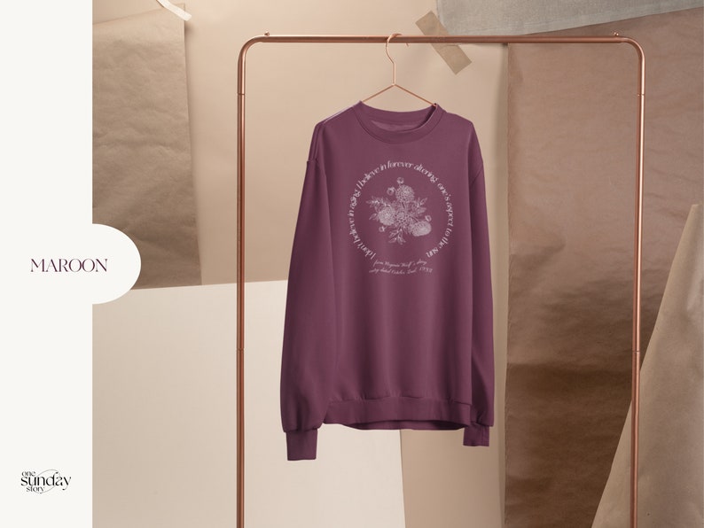 May include: Maroon sweatshirt with a floral design and the text "Love is forever, always, one sweet thing" in a circle around the design.